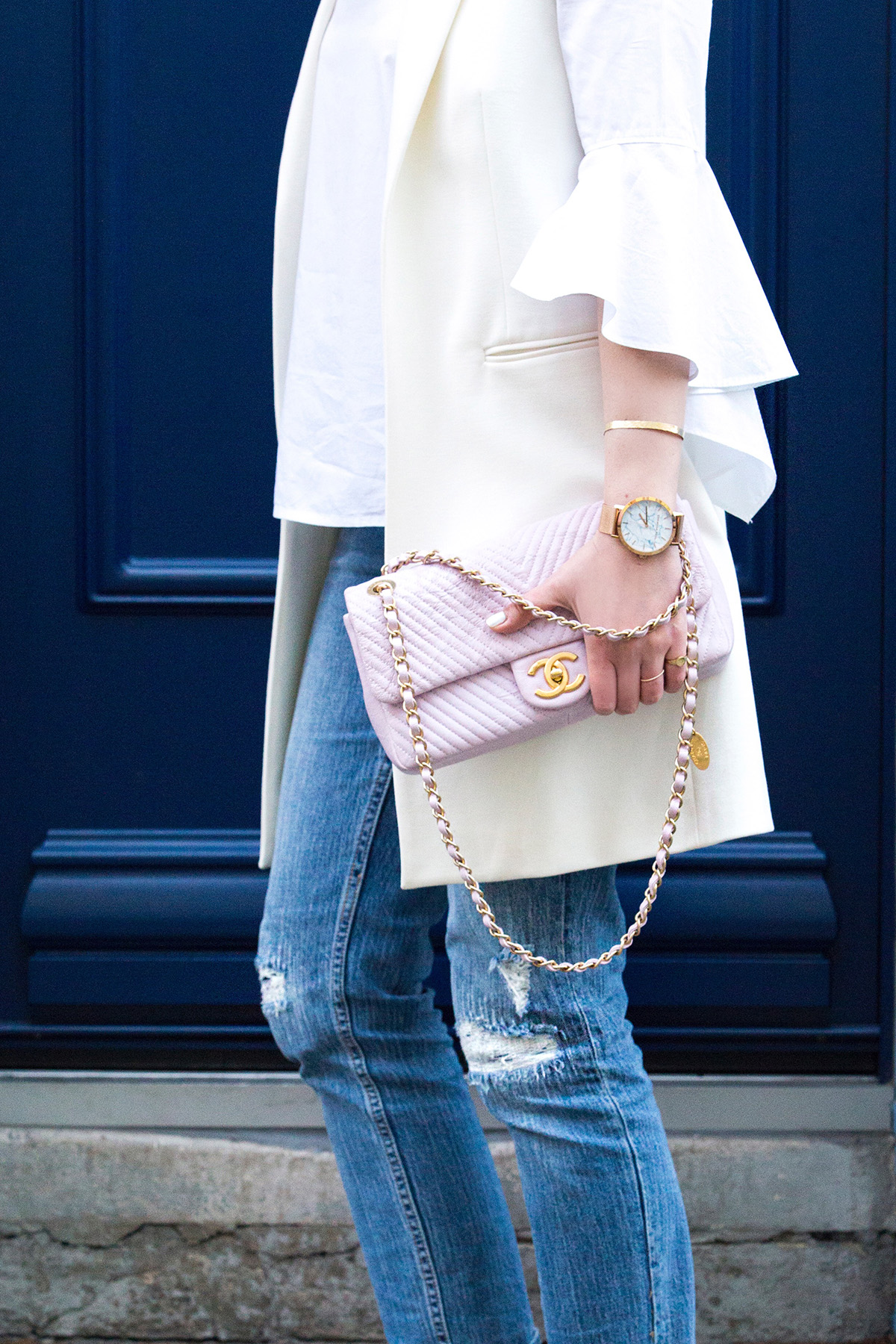 Stella Asteria wearing jeans and Chanel slingbacks, Chanel pink leather chevron bag