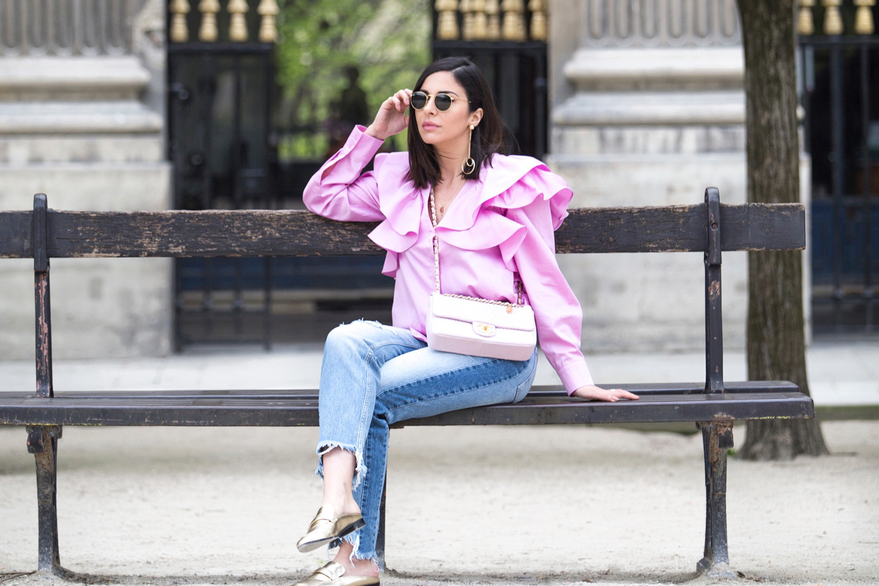 Stella Asteria Fashion & Lifestyle Blogger wearing pink ruffle blouse, jeans and pink Chanel bag