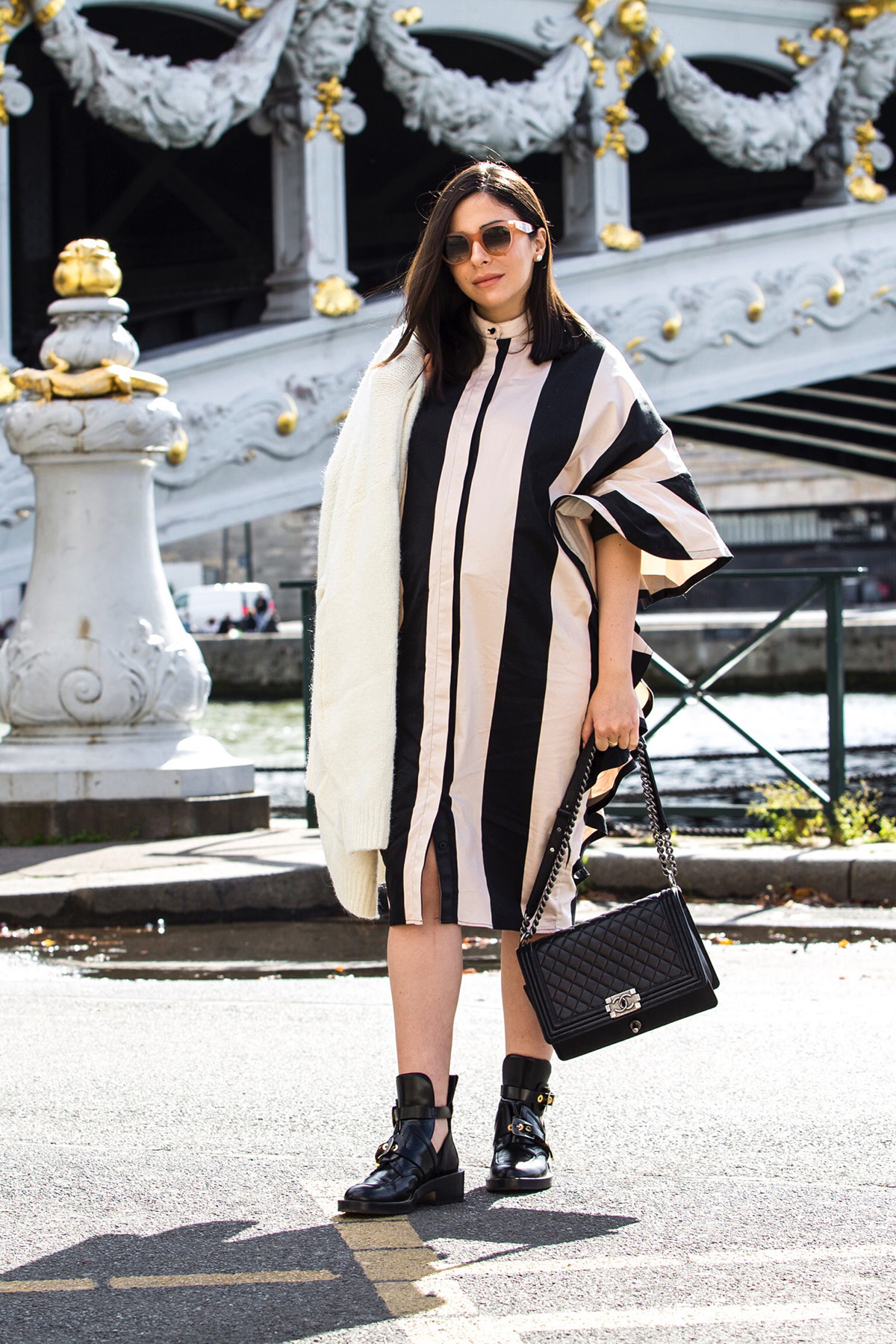 Stella Asteria wearing stripes and ruffles during Paris Fashion Week, with Chanel boy bag and Balenciaga combat boots - Paris Street Style Inspiration