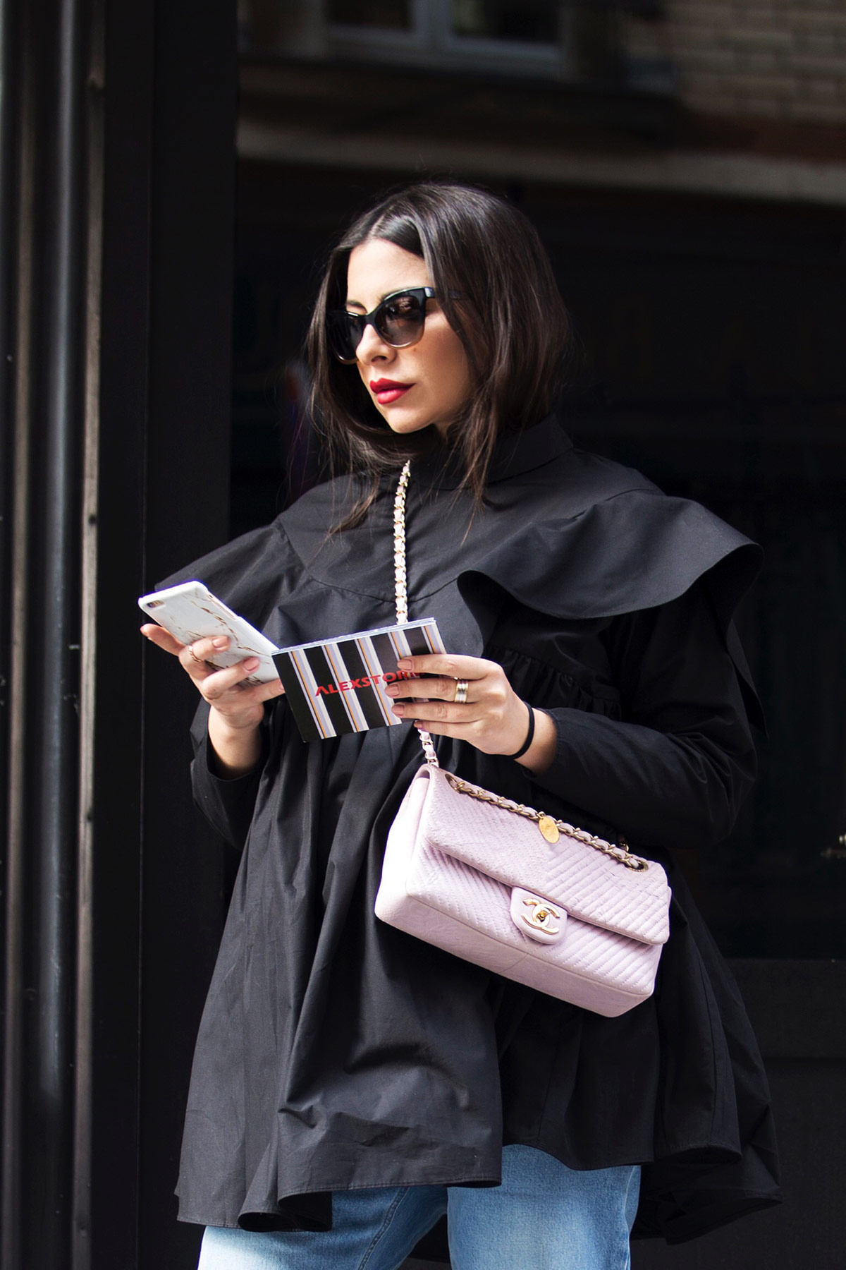 black frill shirt and Chanel bag Stella Asteria at Paris Fashion Week SS18