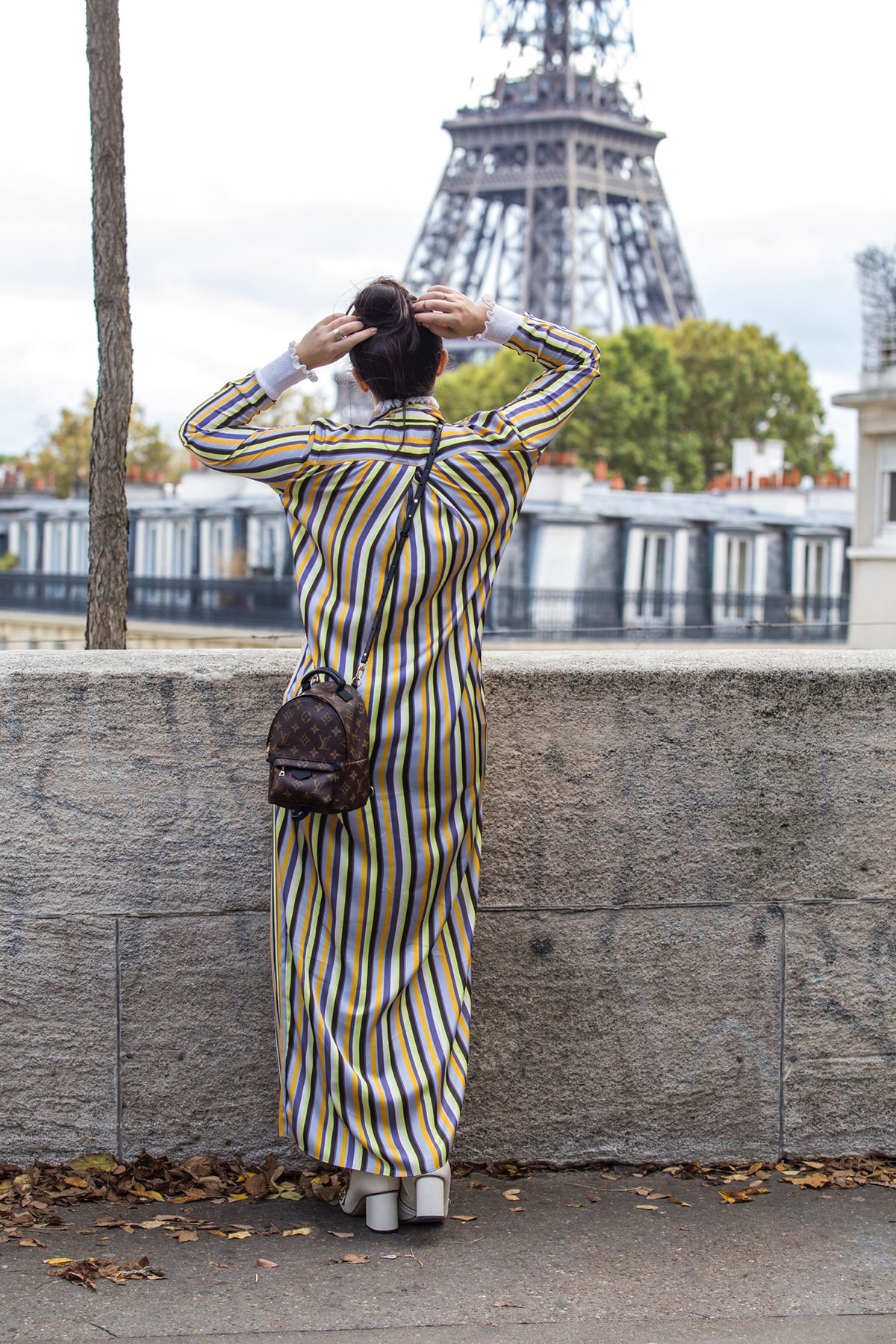 striped Acne dress worn with jeans, Gucci boots and Louis Vuitton Palm Springs backpack by Stella Asteria during Paris Fashion Week SS'18 - Paris Streetstyle and Street Fashion
