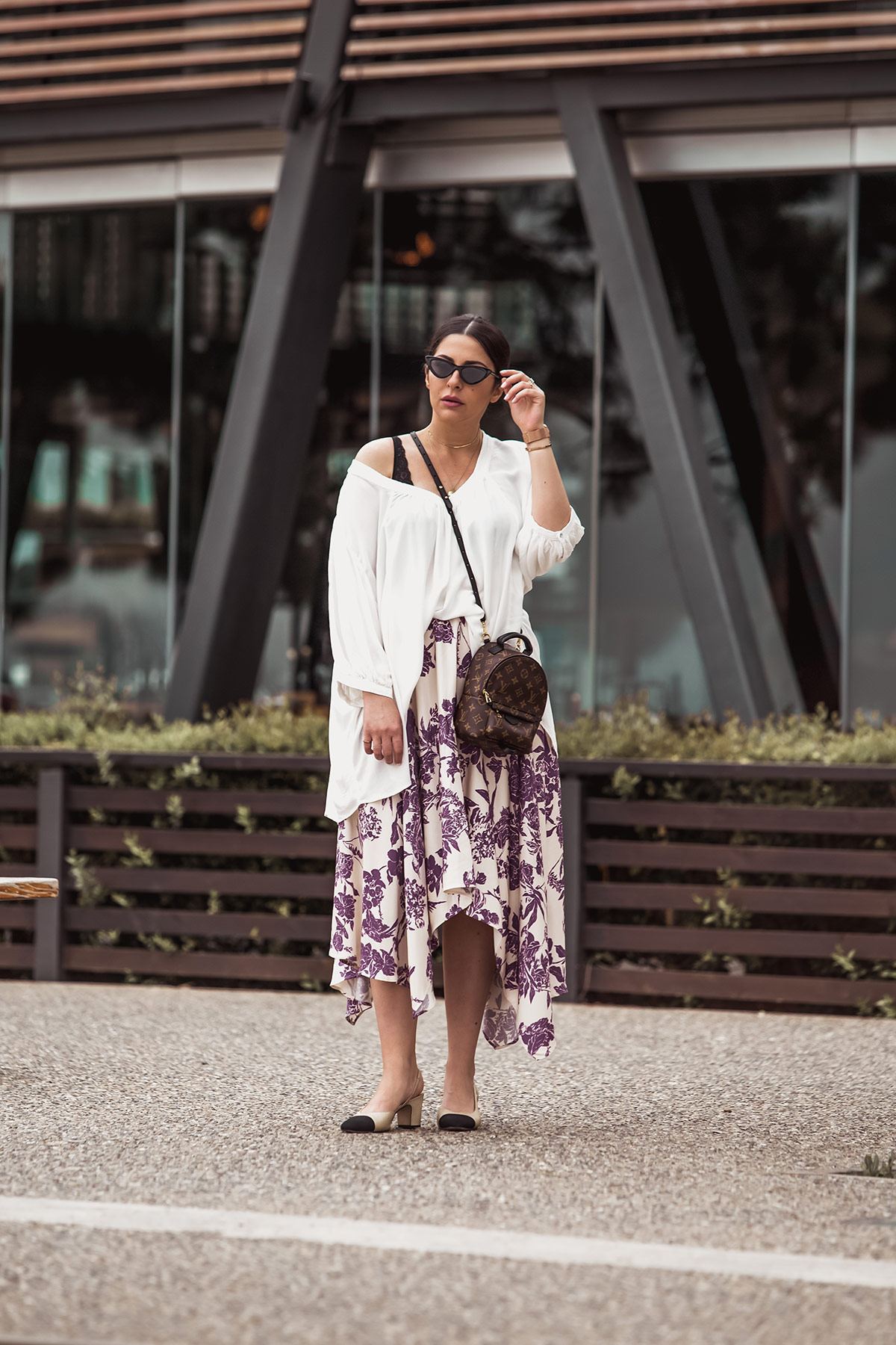 5 Tips To Rock The Oversized Look by Stella Asteria - Wearing oversized short, asymmetrical skirt, Louis Vuitton Palm Springs backpack, Chanel slingbacks and cat-eye sunglasses - Spring Style Inspiration