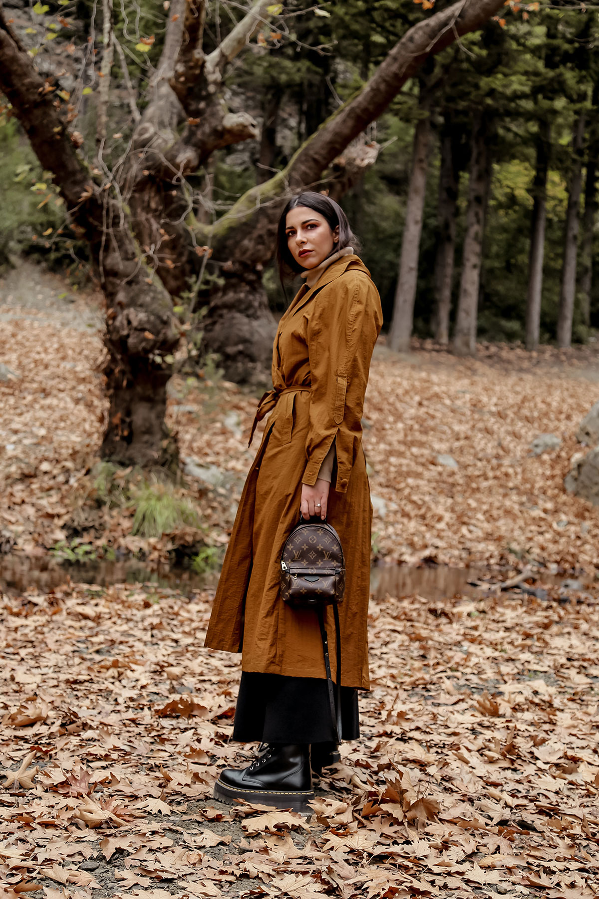 Trench coat and other favourite fall wardrobe staples by Stella Asteria - wearing turtleneck sweater with knit skirt and Dr Martens boots, vintage trench coat